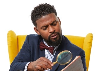 Story Time narrator reading a book with a magnifying glass